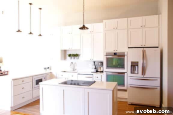 Overall view of the elegant and bright white kitchen remodel