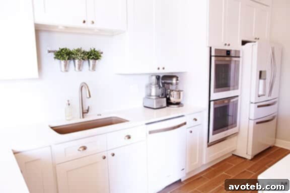 Close-up of sparkling white kitchen appliances and countertops, showcasing the bright aesthetic