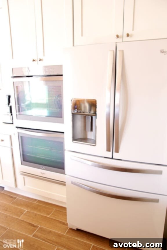 Sleek Whirlpool White Ice refrigerator, central to the modern kitchen design