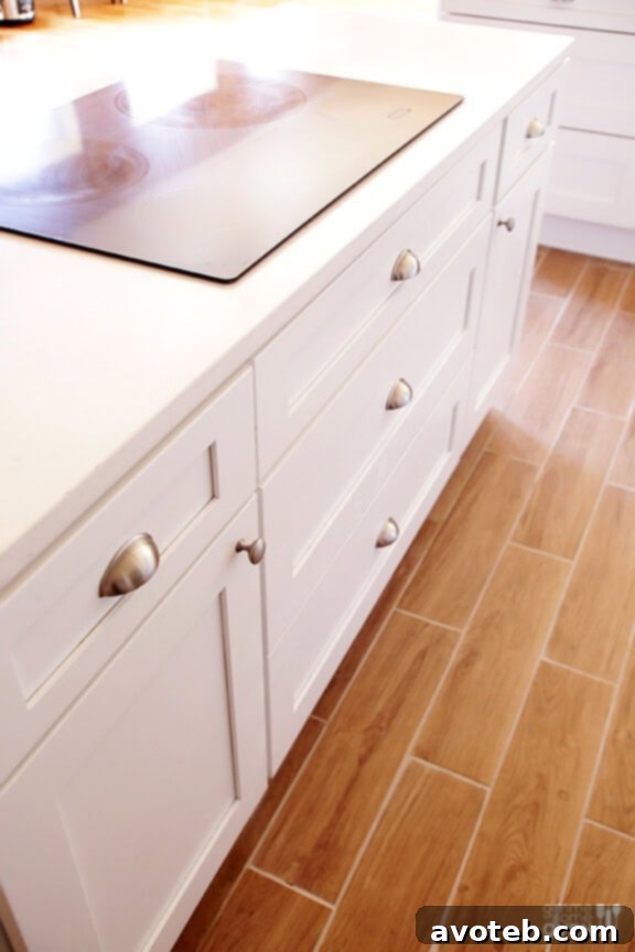 Modern Whirlpool double ovens and cooktop, perfectly integrated into white kitchen decor