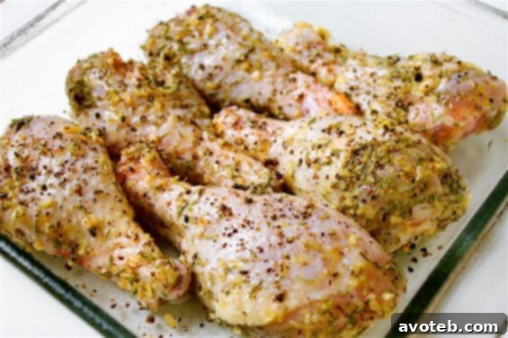 Baked Lemon, Garlic & Thyme Chicken Drumsticks served with roasted vegetables