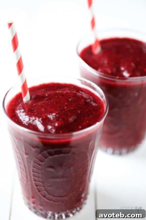 A simple yet appetizing Berry Smoothie, rich in color and inviting texture, garnished with fresh berries.