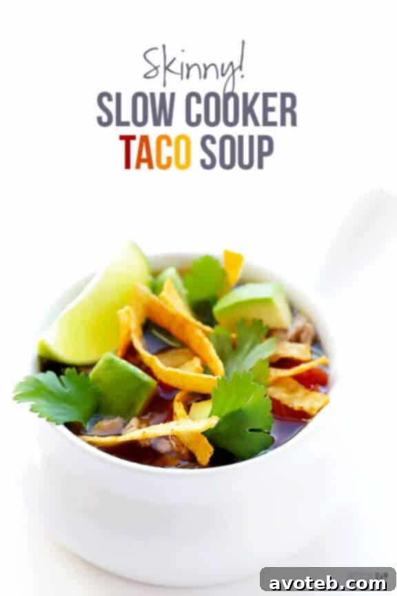 A final close-up of the Skinny Slow Cooker Taco Soup, garnished with fresh toppings, inviting viewers to try the recipe.