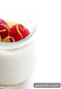 Lighter No-Bake Cheesecake in a jar with raspberries