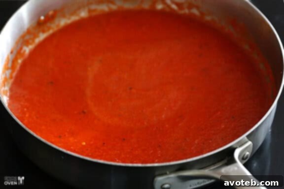 Pureed roasted red pepper mixture in a blender.