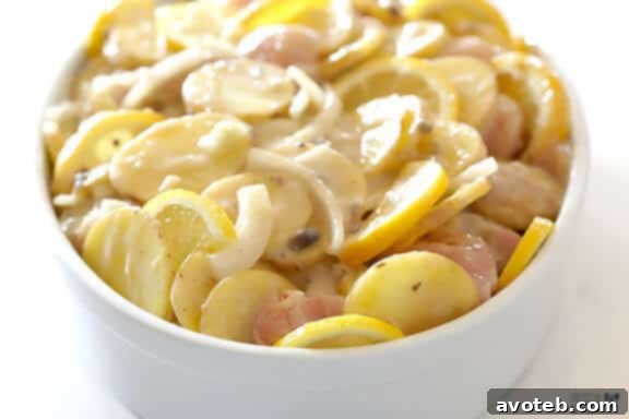 Lemon slices tucked into the casserole before baking