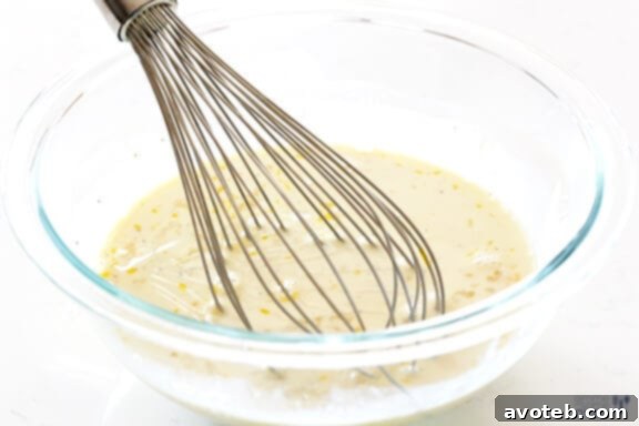 Preparing the creamy sauce base for macaroni and cheese.