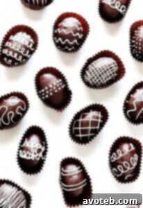 A close-up of a decorated Easter Egg Oreo Truffle, showcasing its delicious appeal.