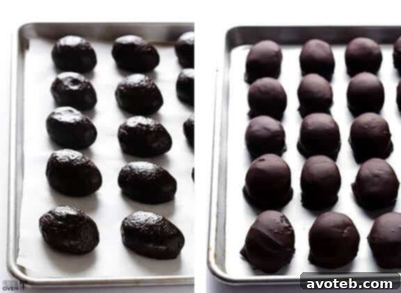 Dipping the chilled Oreo cream cheese eggs into melted dark chocolate for a smooth, even coating.