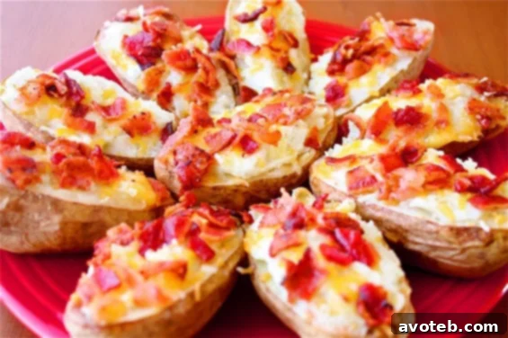 Delicious Blue Cheese Twice-Baked Potatoes with crispy bacon bits on top, served on a rustic wooden board.