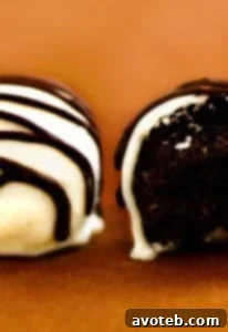 Stacked Oreo Truffles, showcasing a rich, creamy interior and smooth chocolate coating.