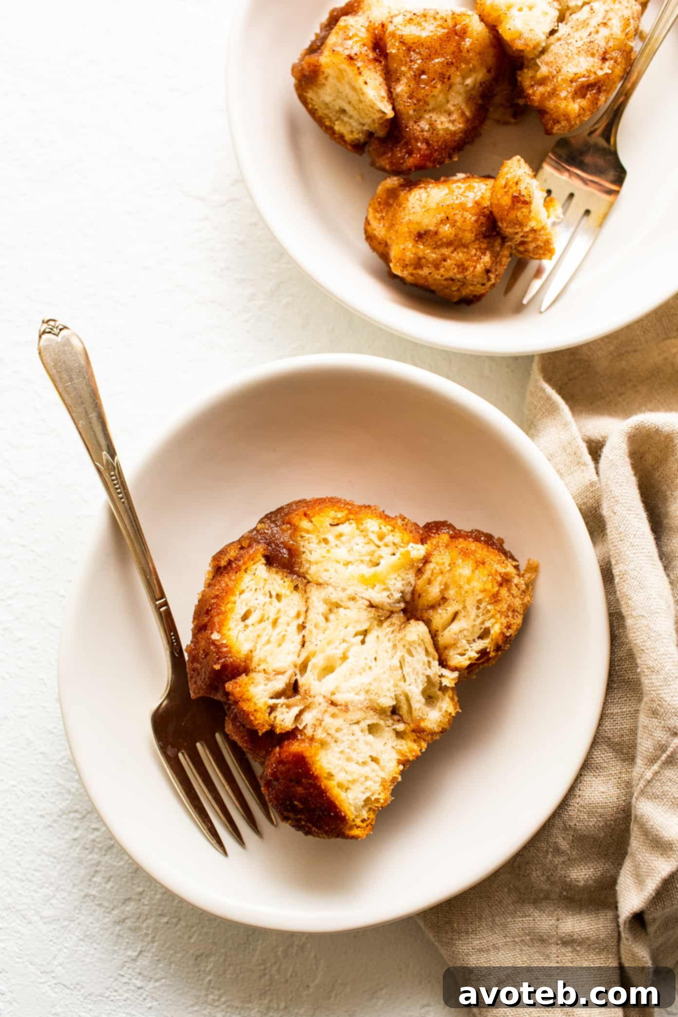 Close-up of a slice of monkey bread on a plate, showing its pull-apart nature