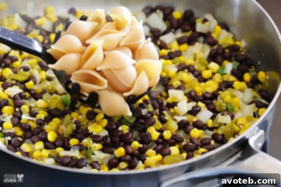 Pasta being prepared for Mexican Macaroni and Cheese