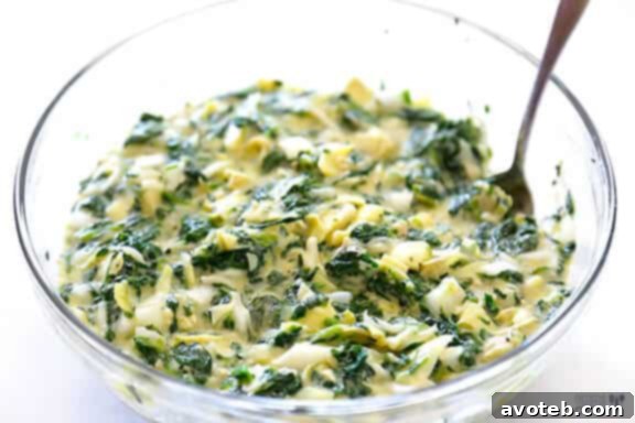 Mixing Ingredients for Spinach Artichoke Quiche Cups
