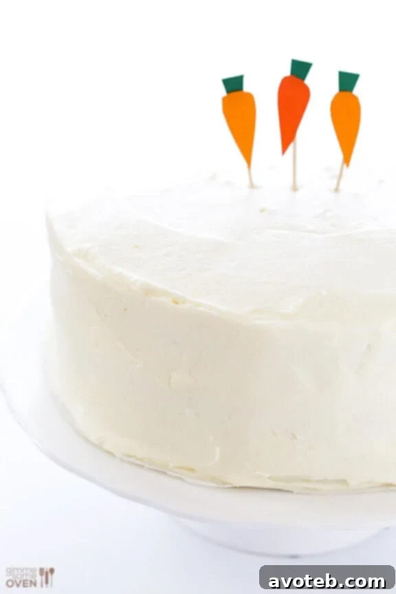 Elegantly frosted Vegan Gluten-Free Carrot Cake, ready for decoration.