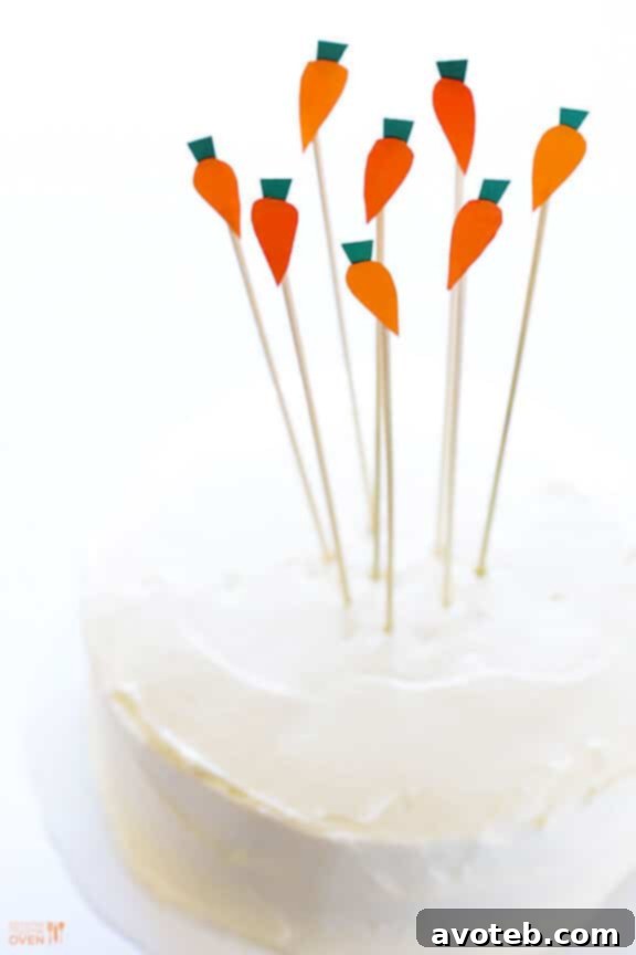 Decorated Vegan Gluten-Free Carrot Cake with playful carrot patch toppers.