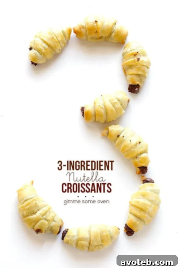 Close-up of golden, flaky Nutella Croissants on a baking sheet