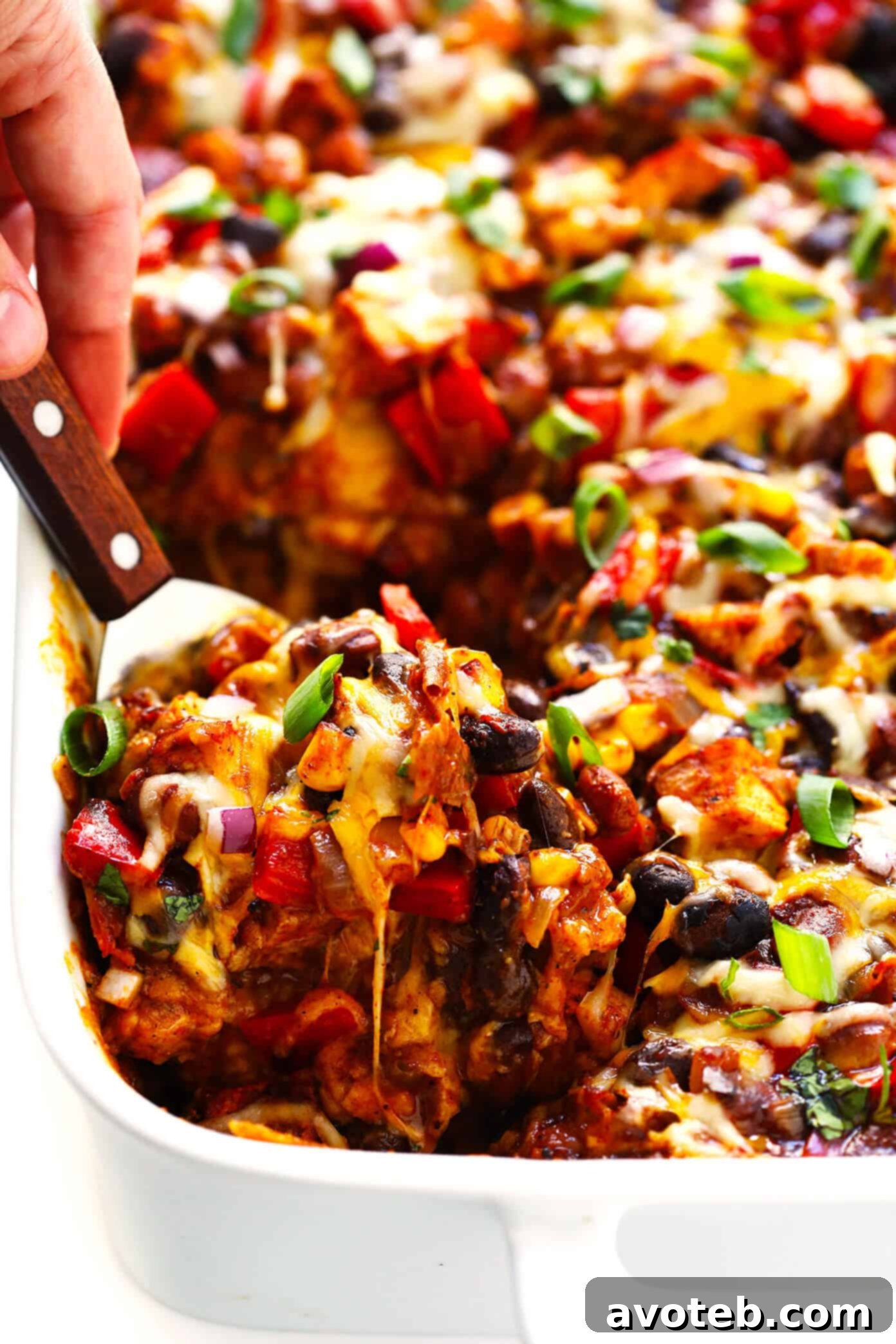 The BEST Chicken Enchilada Casserole Recipe with fresh toppings