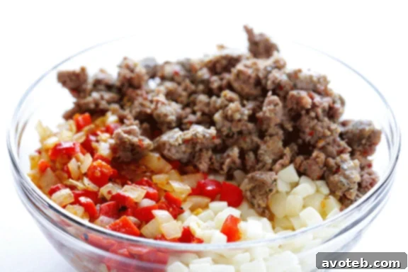 Breakfast Casserole ingredients mixed in a bowl, ready for baking