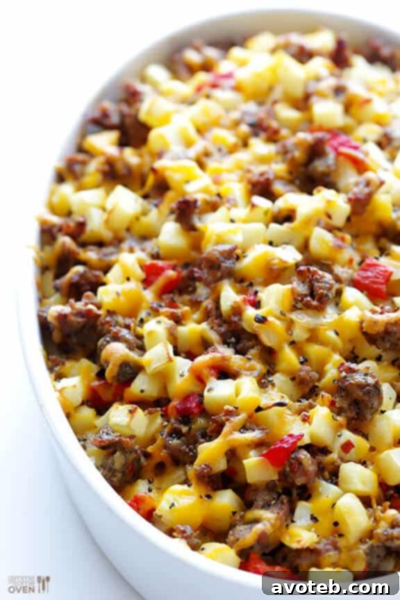 Layered Breakfast Casserole in a baking dish before going into the oven
