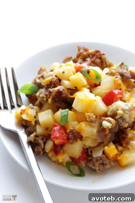 Side view of a slice of Easy Cheesy Breakfast Casserole with a fork
