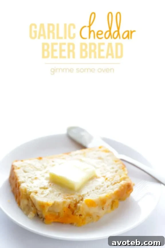 A freshly baked loaf of Garlic Cheddar Beer Bread, ready to be enjoyed.