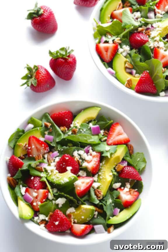 Fresh and Healthy Salad Ideas Close-up of a bowl of Strawberry Kale Salad, highlighting the fresh ingredients and inviting textures.
