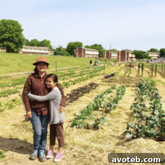 Strawberry Kale Delight 2 Si Si Cho, a refugee farmer from New Roots For Refugees, with her sweet daughter at their urban garden.