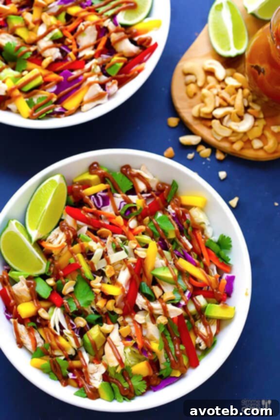 A bowl of freshly chopped colorful vegetables, ready for Rainbow Thai Chicken Salad.