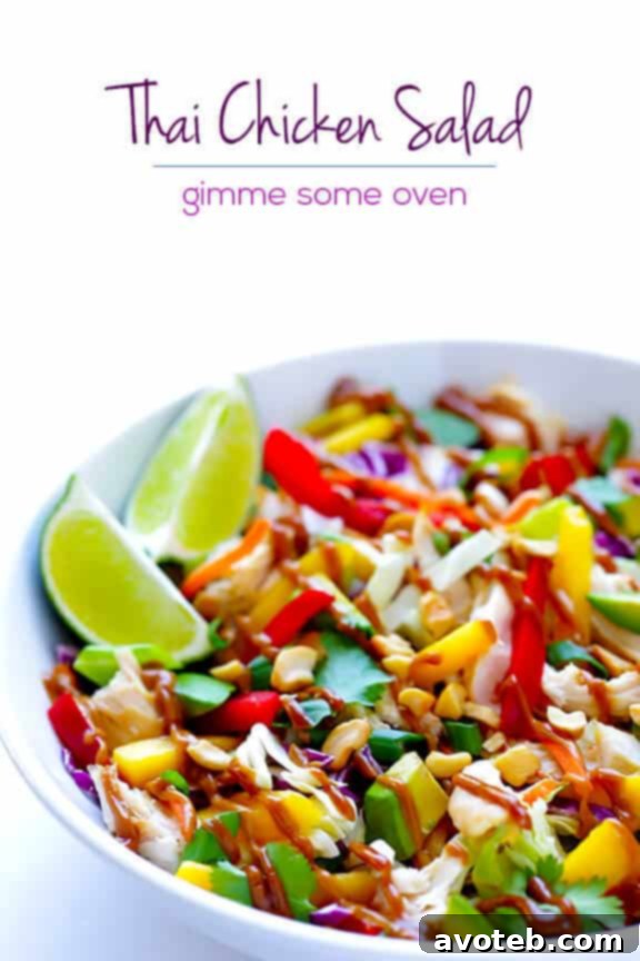 Close-up of a single serving bowl of Rainbow Thai Chicken Salad, highlighting the fresh, crisp ingredients and dressing.