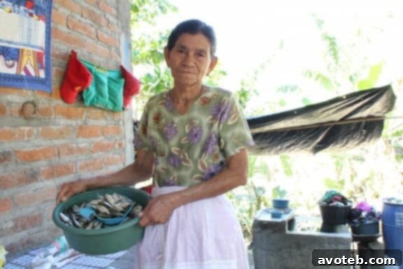 Elderly individuals smiling, beneficiaries of Unbound's sponsorship program