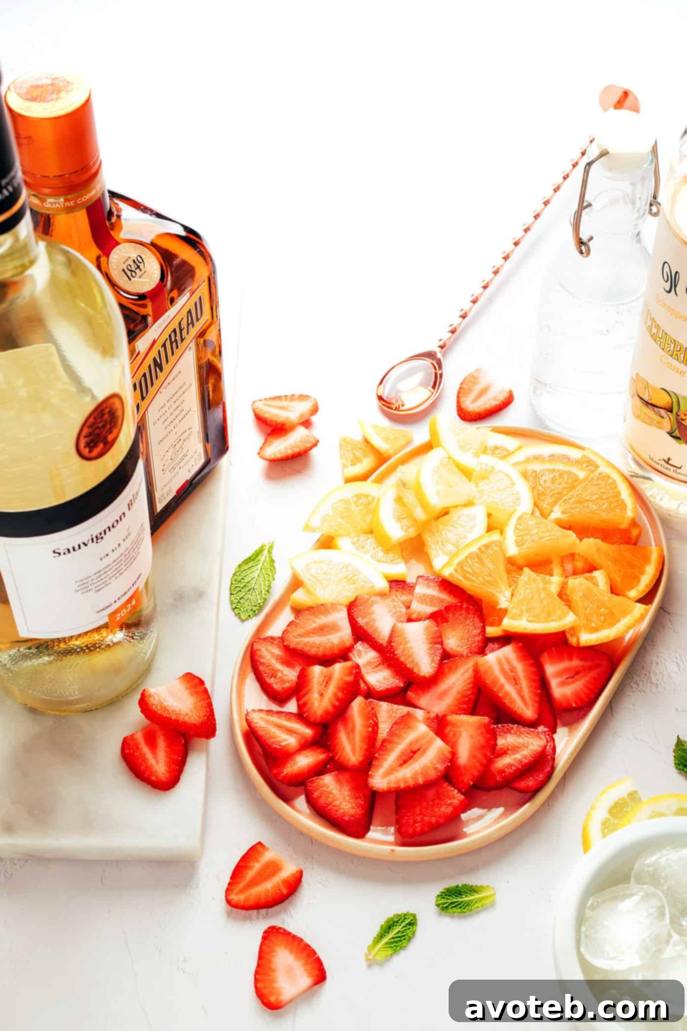 strawberry sangria ingredients on a rustic wooden table