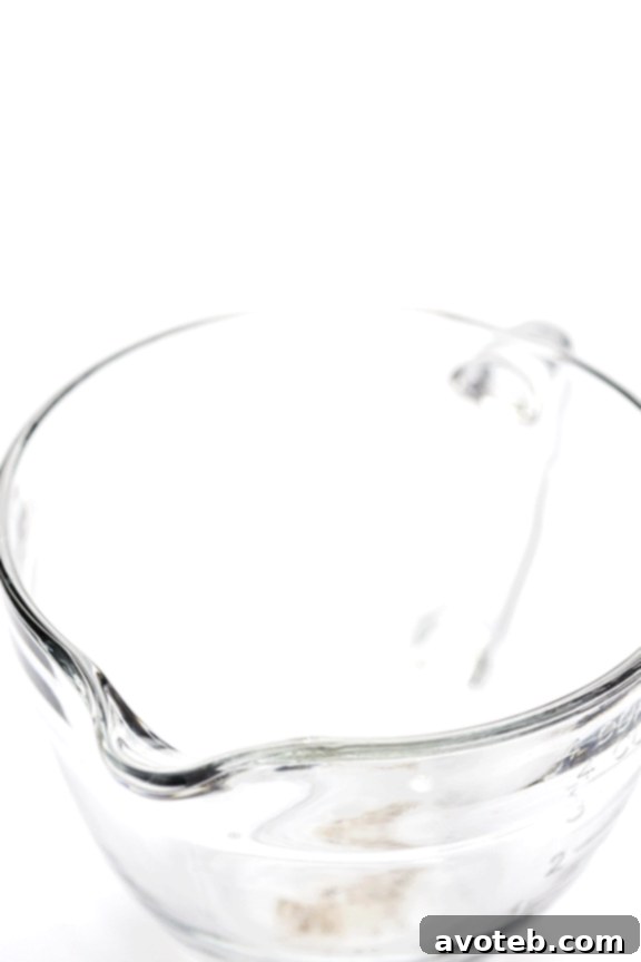 Steeping coarsely ground coffee in cold water for cold brew
