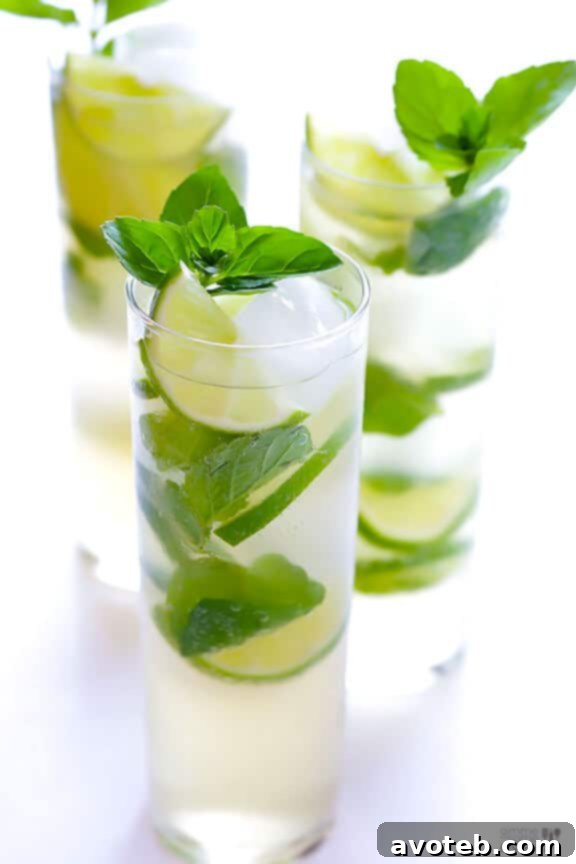 Easy Ginger Beer Mojito preparation: muddle mint and lime, add ice, rum, and ginger beer