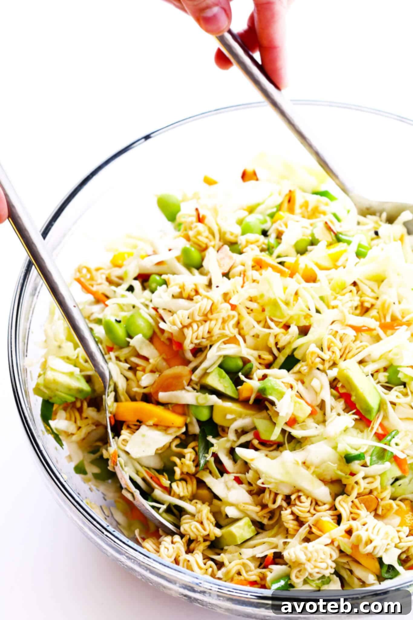 Close-up of toasted ramen noodles and sliced almonds on a baking sheet, golden and perfectly crunchy, ready to be added to the salad.