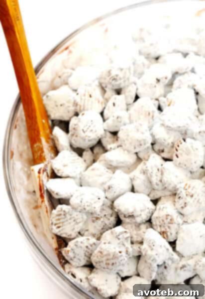 Delicious Puppy Chow (Muddy Buddies) ready to eat, shown in a bowl.