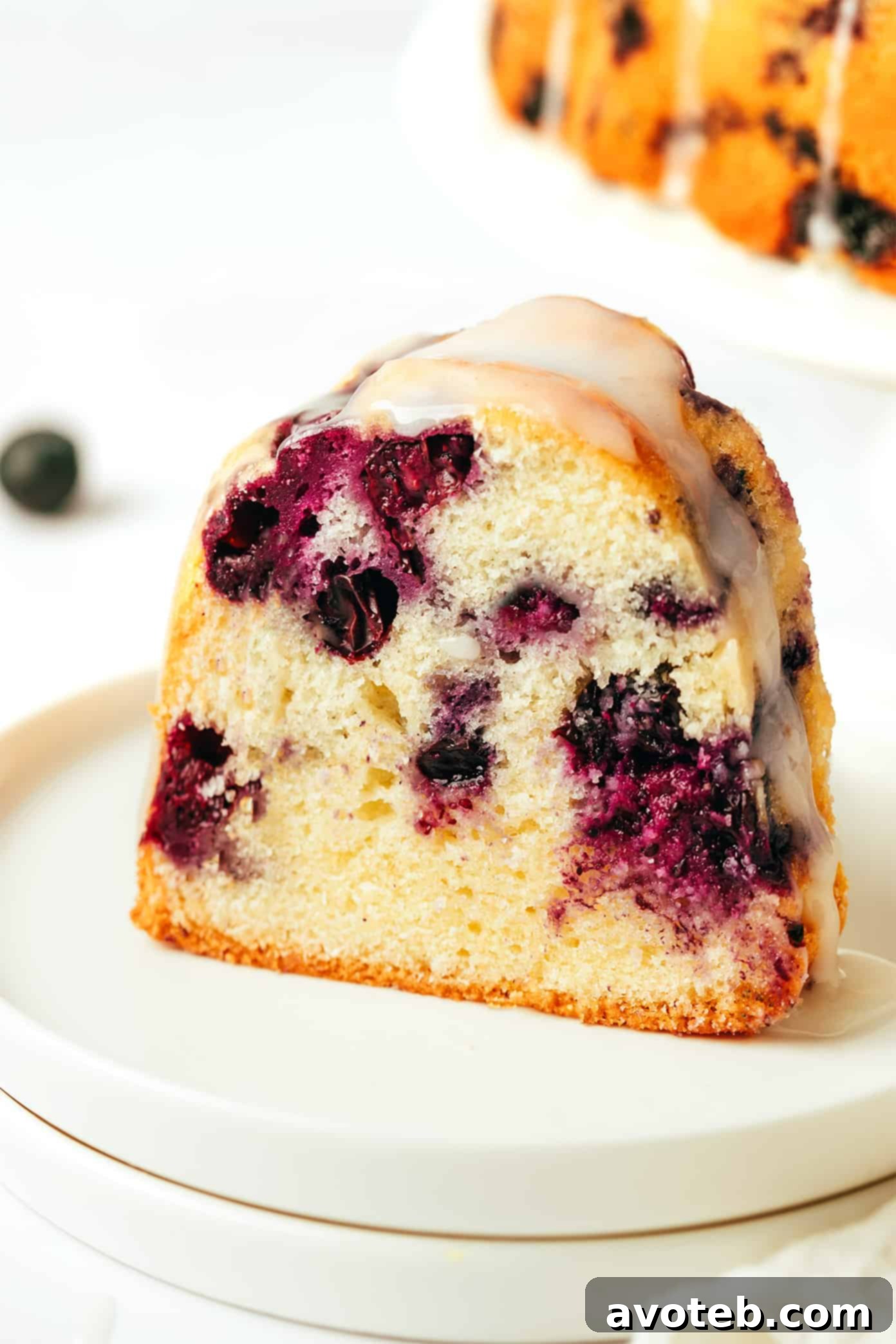 A slice of blueberry bundt cake on a plate