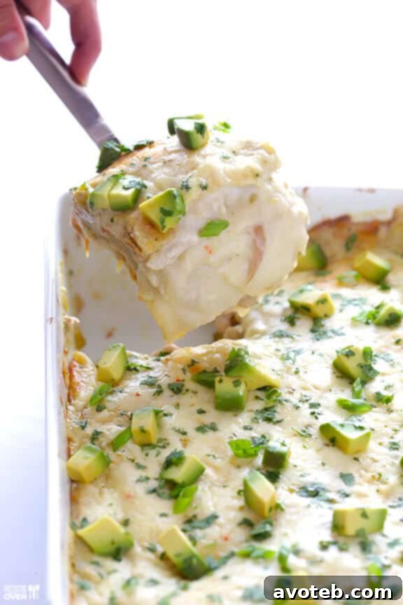Serving a portion of White Chicken Enchilada Casserole.