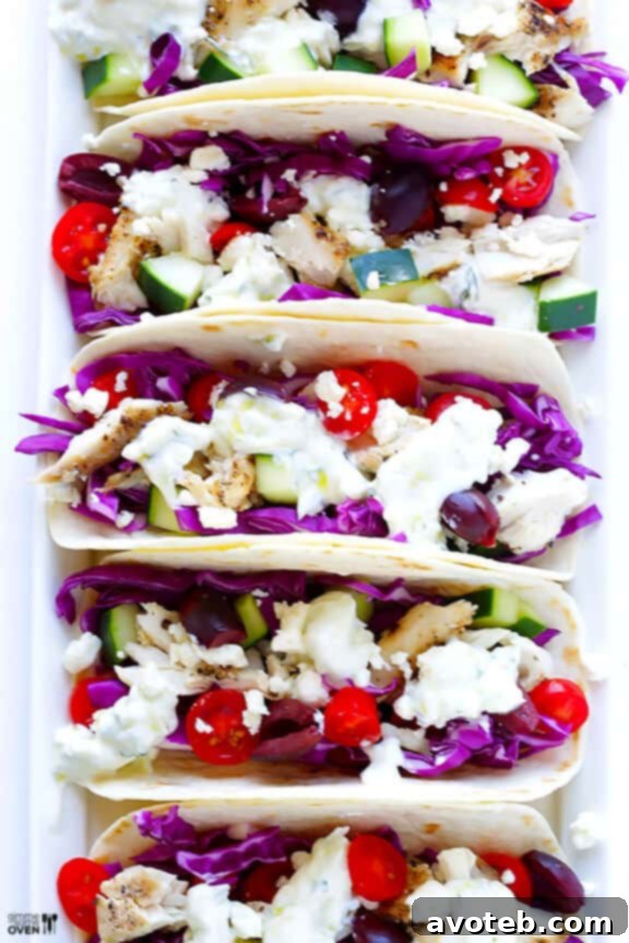 Close-up of freshly prepared Greek Fish Tacos on a platter, showcasing vibrant colors