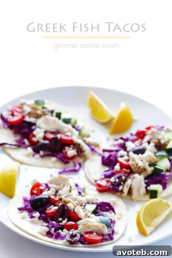 A final vibrant image of Greek Fish Tacos, perfectly plated with a fresh background