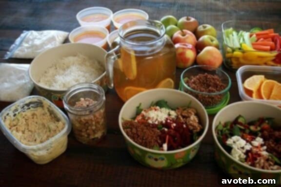 Organized meal prep for single serving meals, featuring various containers of food.