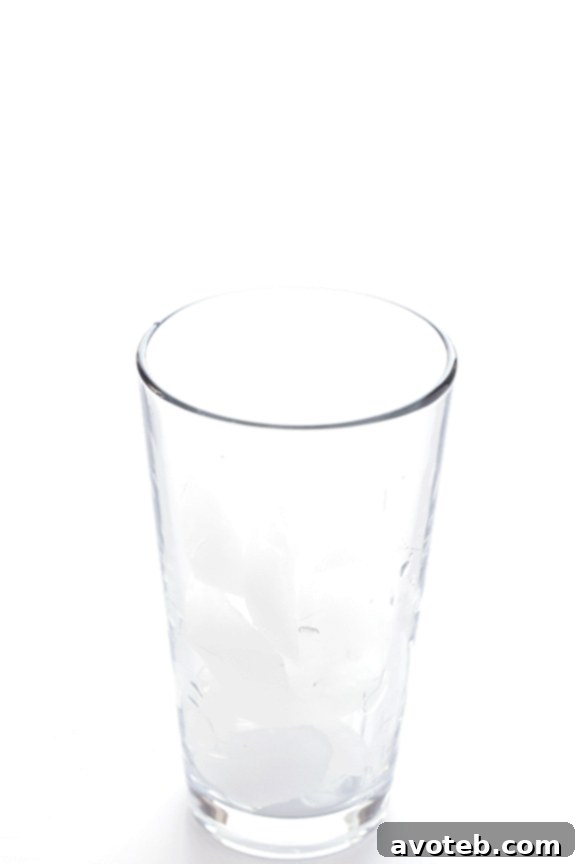 Coconut Water Iced Coffee - A naturally sweet and hydrating cold brew option Close-up of Coconut Water Iced Coffee in a glass, showing ice and the refreshing texture. Highlights the natural and clean ingredients of this healthy beverage.
