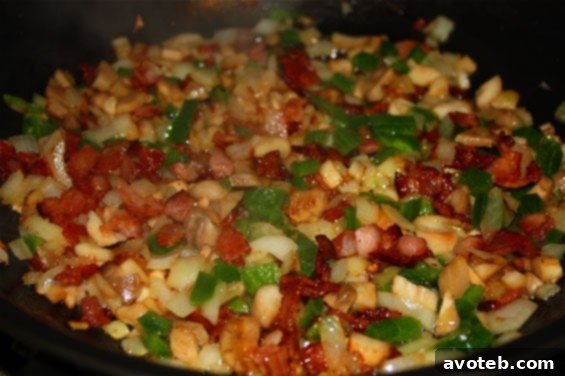 Platter of freshly baked Bacon & Jalapeno Stuffed Mushrooms, garnished and ready to serve at a party.
