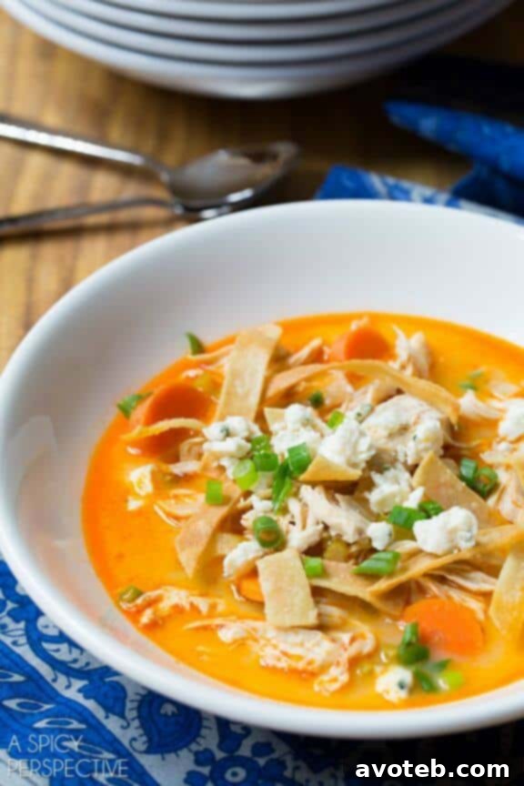 A creamy and spicy Slow Cooker Buffalo Chicken Soup, perfect for game day or a cozy night.