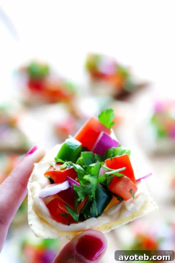 Close-up of freshly prepared Pico Nacho Bites on a platter.