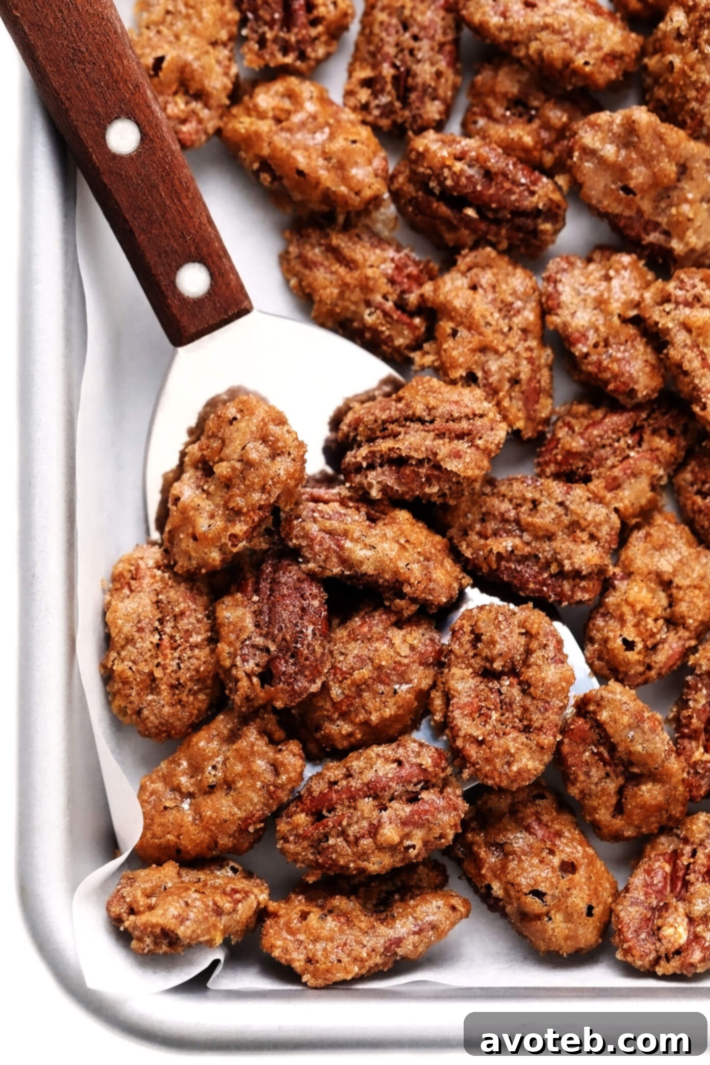 Close-up of perfectly candied pecans, showcasing their crunchy, sugary coating