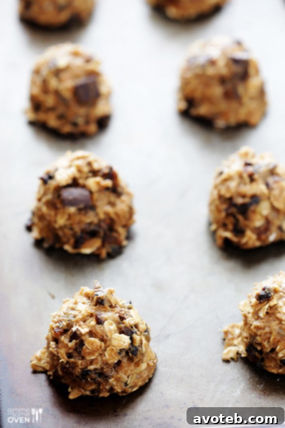 Close-up of a scooped breakfast cookie on a baking sheet