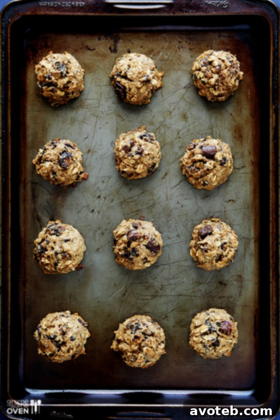 Soft and warm breakfast cookies cooling on a baking sheet