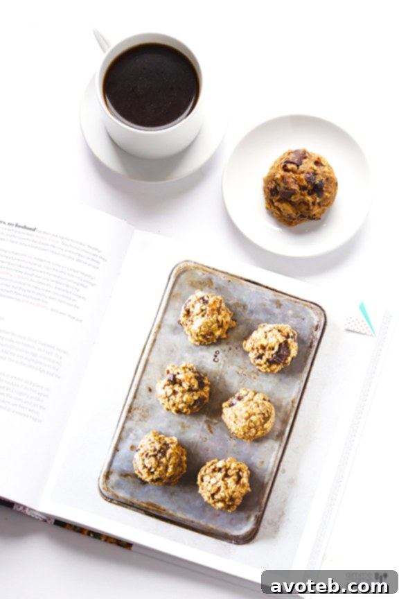 A plate of freshly baked breakfast cookies with a cup of coffee, ready for breakfast