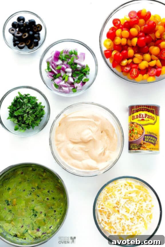 A vibrant and fresh 7 Layer Dip, perfect for any gathering or game day celebration.